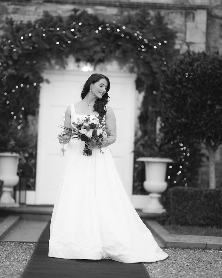 Dylan and Siobhan — portrait in the Ballymagarvey courtyard, ivy walls and afternoon light