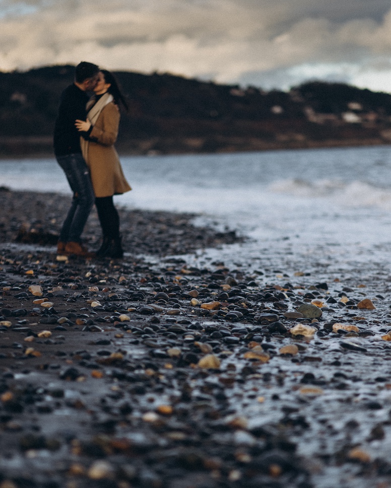 Couples portrait at Killiney Beach, Dalkey — golden hour photography Dublin Bay