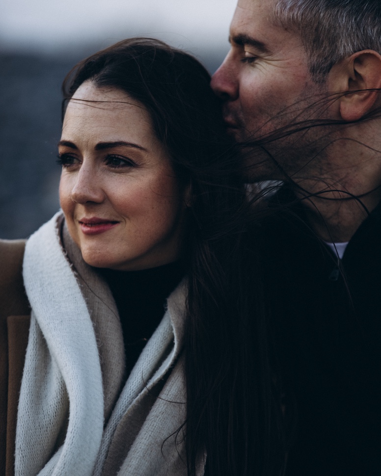 Jolene and Stephen walking the shore at Killiney — seaside love story session