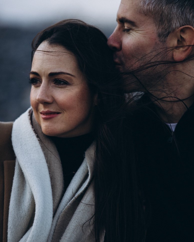 Jolene and Stephen walking the shore at Killiney — seaside love story session